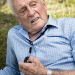 Elderly-Australian-talking-with-his-family-using-Livelife-alarm-device