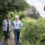 senior lady and man wearing a live life alarm emergency pendant